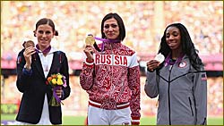 Medallists pose during the 400m Hurdles Victory Ceremony